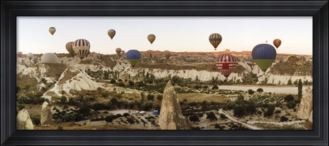 Framed Mulit colored hot air balloons at sunrise over Cappadocia, Central Anatolia Region, Turkey Print