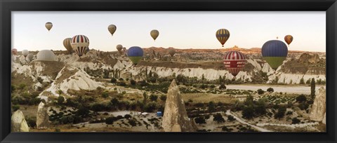 Framed Mulit colored hot air balloons at sunrise over Cappadocia, Central Anatolia Region, Turkey Print