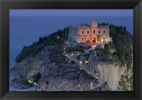 Framed High angle view of a church lit up at dusk on a cliff, Santa Maria dell Isola, Tropea, Calabria, Italy Print