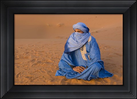 Framed Veiled Tuareg man sitting cross-legged on the sand, Erg Chebbi, Morocco Print
