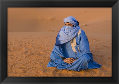 Framed Veiled Tuareg man sitting cross-legged on the sand, Erg Chebbi, Morocco Print