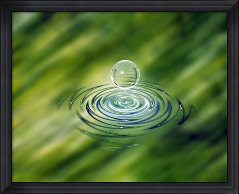 Framed Clear bubble rising from ripples in mottled green water Print