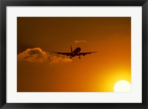 Framed Silhouette of airliner in golden sunset Print