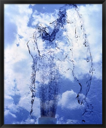 Framed Slow motion geyser of water rising through blue sky and clouds Print