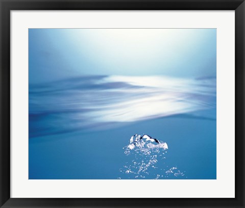 Framed Water bubbles rising to surface of water toward bright light Print