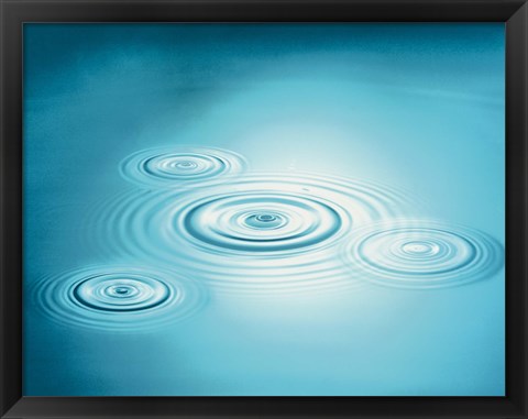 Framed Multiple rings in blue water with bright light reflection Print