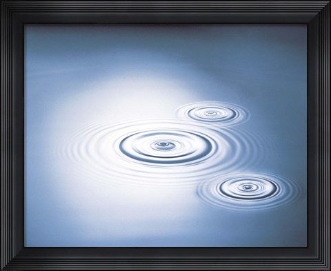 Framed Three rings in grey tinted water with bright light Print