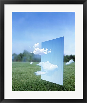 Framed White clouds passing through a pale blue horizontal of sky with green grass, trees and sky in the distance Print
