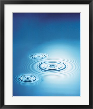 Framed Three rings in blue water with bright light reflection Print