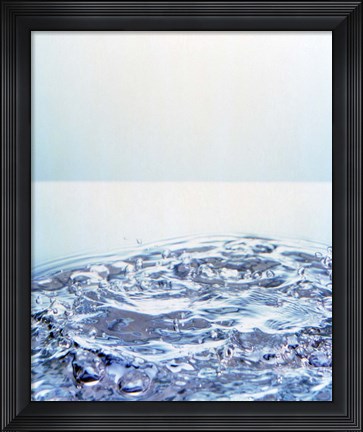 Framed Churning water bubbles in bright light Print