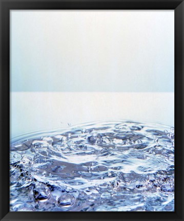 Framed Churning water bubbles in bright light Print