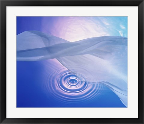 Framed Downward view of ring in lavender water with floating fabric in foreground and brightly lit background Print