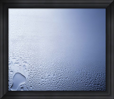 Framed Water drops on clear glass with purple background Print