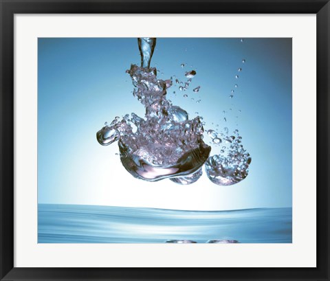 Framed Iridescent water bubble formation floating above the surface of deep blue water Print