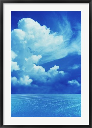 Framed White clouds in dark blue sky over rippling water Print