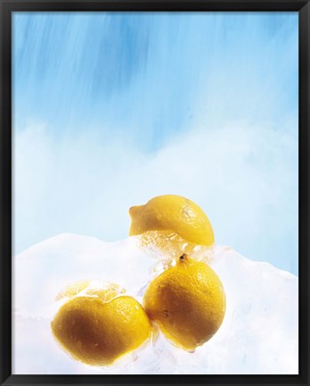 Framed Three lemons frozen in ice below ice blue sky Print