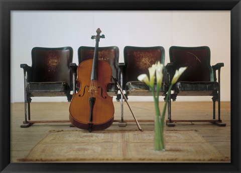 Framed Cello leaning on attached chairs Print