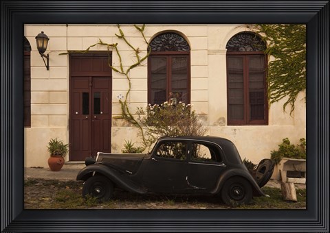 Framed Vintage car parked in front of a house, Calle De Portugal, Colonia Del Sacramento, Uruguay Print