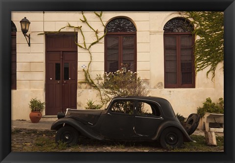 Framed Vintage car parked in front of a house, Calle De Portugal, Colonia Del Sacramento, Uruguay Print