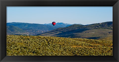 Framed Hot air balloon flying in a valley, Park City, Utah, USA Print