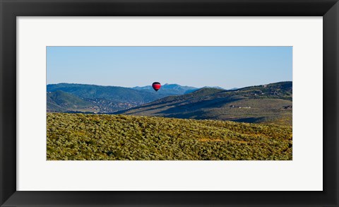 Framed Hot air balloon flying in a valley, Park City, Utah, USA Print