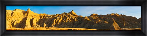 Framed Rock formations on a landscape in golden light, Saddle Pass Trail, Badlands National Park, South Dakota, USA Print