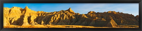 Framed Rock formations on a landscape in golden light, Saddle Pass Trail, Badlands National Park, South Dakota, USA Print