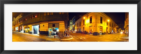 Framed Shops along a street at night, Lima, Peru Print