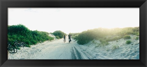 Framed Rear view of a couple cycling along a beach trail, Fort Tilden, Queens, New York City, New York State, USA Print