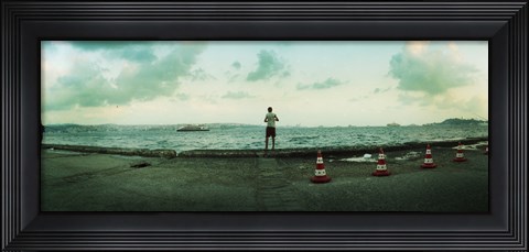 Framed Boy looking out on the Bosphorus Strait, Istanbul, Turkey Print