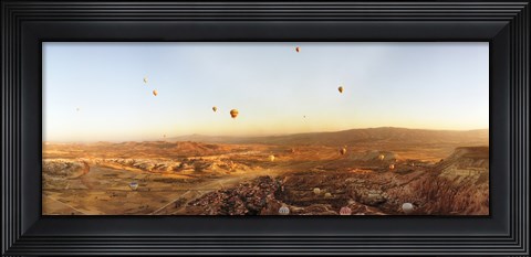 Framed Hot air balloons over a village in Cappadocia, Central Anatolia Region, Turkey Print