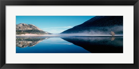 Framed Reflection of a mountain with snowy trees on a lake in winter afternoon, Cote d&#39;Azur, France Print