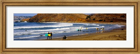 Framed Surfers on the beach, California, USA Print