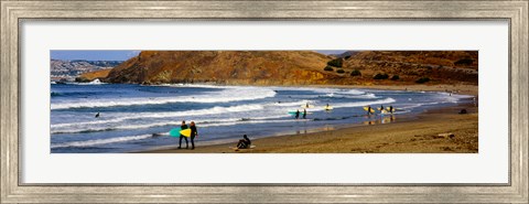 Framed Surfers on the beach, California, USA Print