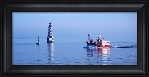 Framed Les Perdrix lighthouse and fishing boat at Loctudy, Brittany, France Print