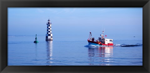 Framed Les Perdrix lighthouse and fishing boat at Loctudy, Brittany, France Print
