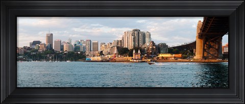 Framed Skyscrapers at the waterfront, McMahons Point, Sydney Harbor Bridge, Sydney Harbor, Sydney, New South Wales, Australia 2012 Print