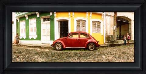 Framed Small old red car parked in front of colorful building, Pelourinho, Salvador, Bahia, Brazil Print