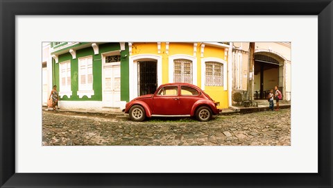 Framed Small old red car parked in front of colorful building, Pelourinho, Salvador, Bahia, Brazil Print