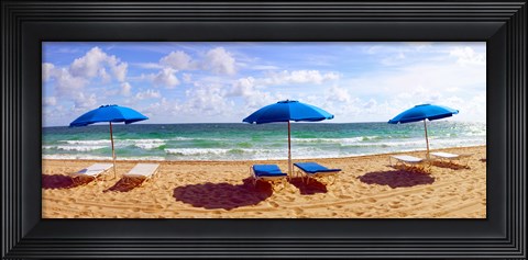 Framed Lounge chairs and beach umbrellas on the beach, Fort Lauderdale Beach, Florida, USA Print