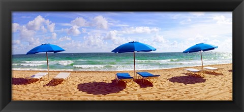 Framed Lounge chairs and beach umbrellas on the beach, Fort Lauderdale Beach, Florida, USA Print