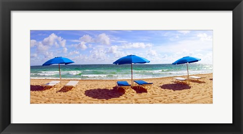 Framed Lounge chairs and beach umbrellas on the beach, Fort Lauderdale Beach, Florida, USA Print