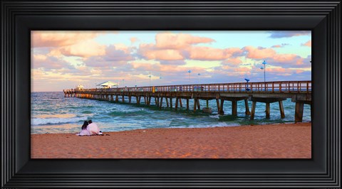 Framed Couple sitting on the beach at sunset, Fort Lauderdale, Florida, USA Print