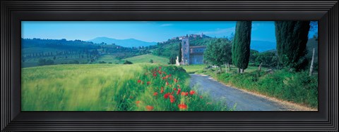 Framed Road passing through field Print