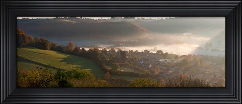 Framed Misty morning valley with village, Uley, Gloucestershire, England Print