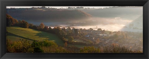 Framed Misty morning valley with village, Uley, Gloucestershire, England Print