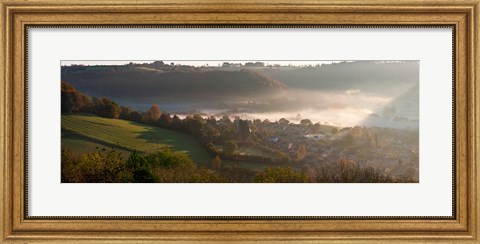 Framed Misty morning valley with village, Uley, Gloucestershire, England Print