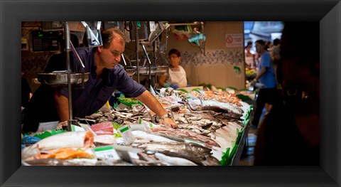 Framed Fishmonger at a fish stall, La Boqueria Market, Ciutat Vella, Barcelona, Catalonia, Spain Print
