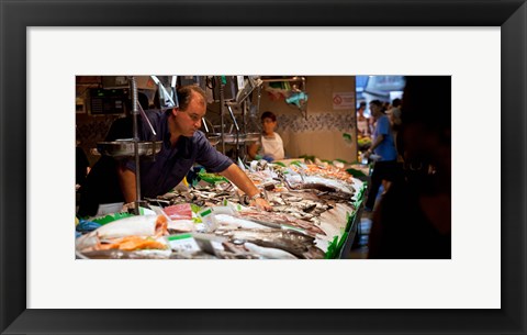 Framed Fishmonger at a fish stall, La Boqueria Market, Ciutat Vella, Barcelona, Catalonia, Spain Print