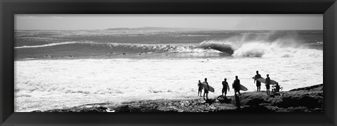 Framed Silhouette of surfers standing on the beach, Australia (black and white) Print